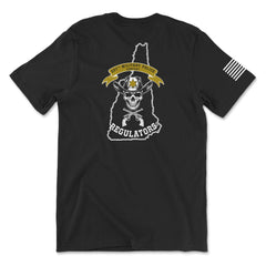 Back view of a black t-shirt for the 237th Military Police Company. The design features a skull wearing a blue beret and a gas mask, set against a white outline of the state of Massachusetts. A yellow banner reads '237th MILITARY POLICE COMPANY' above crossed flintlock pistols and the word 'REGULATORS' in white. A white American flag patch is visible on the right sleeve.