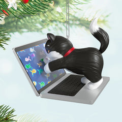 Mischievous Kittens, 27th in the Series — 2025 Hallmark Keepsake Christmas Ornament, black-and-white tuxedo cat on laptop with fish images, close up view.